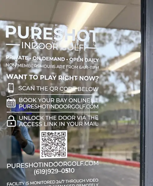 Pureshot's glass entry door with self-access instructions: book online, then unlock the door with the link in your email